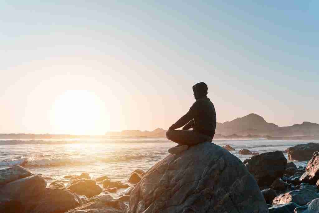 A person sitting meditating