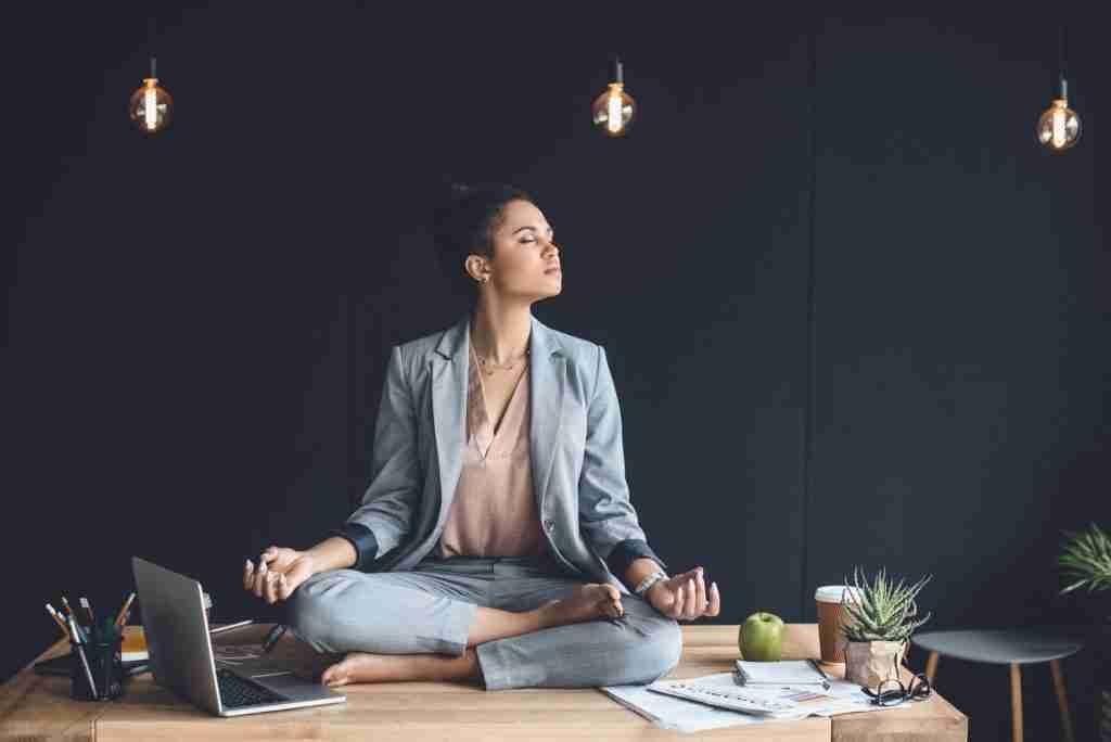 A lady meditating at work