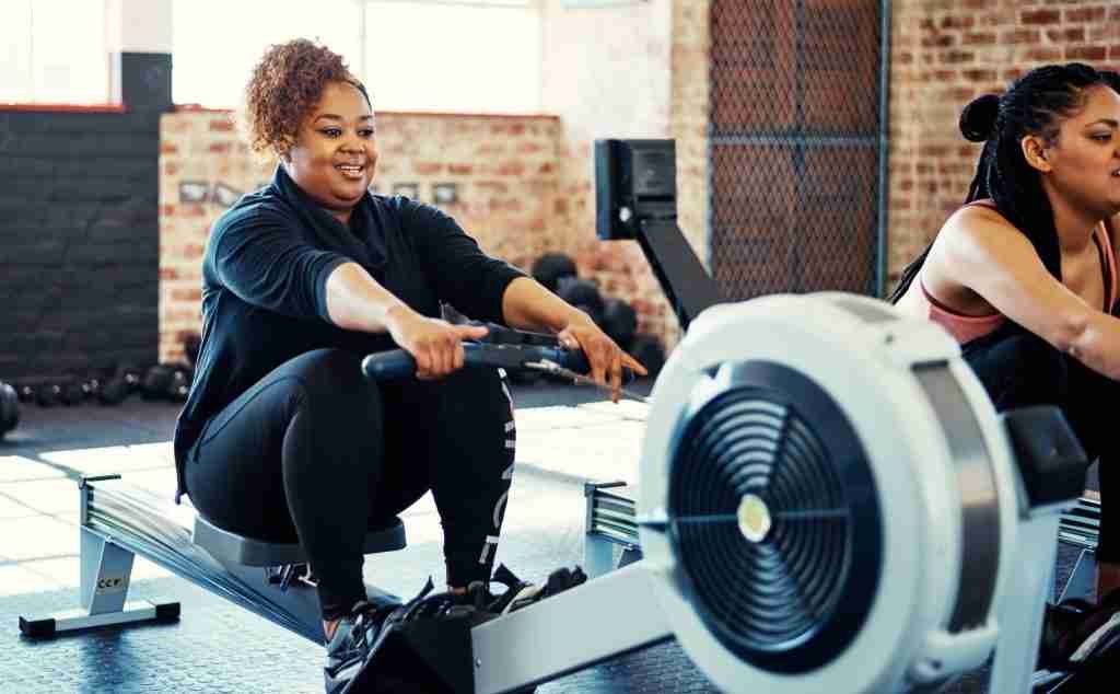 A lady using a rowing Machine