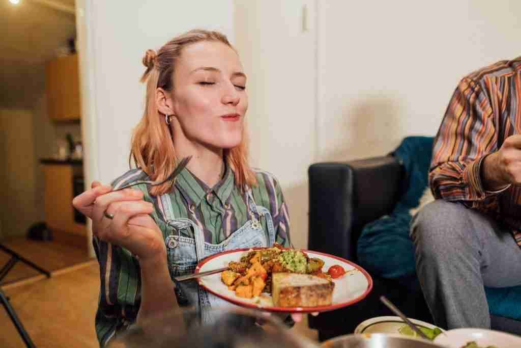 Lady eating a vegan dinner