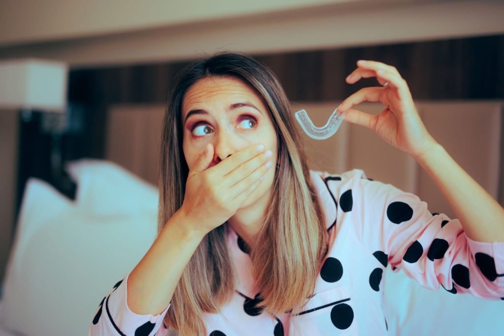 Lady using a mouth guard for sleep