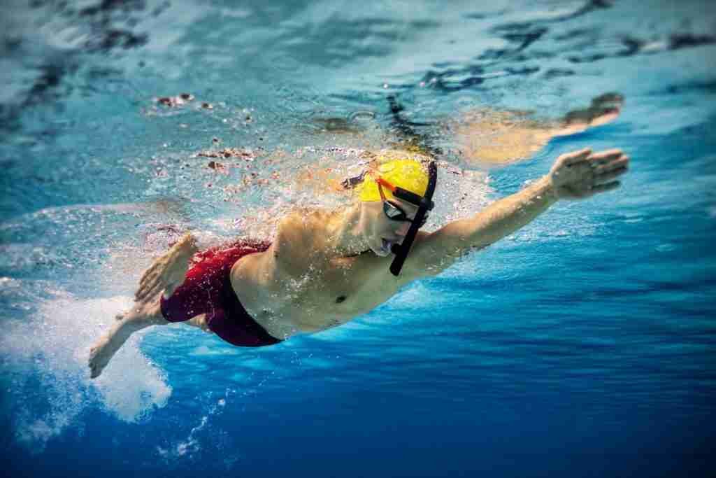 Male swimming in the pool