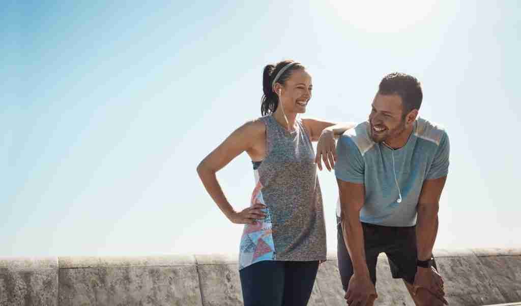 Man and Women resting after a run