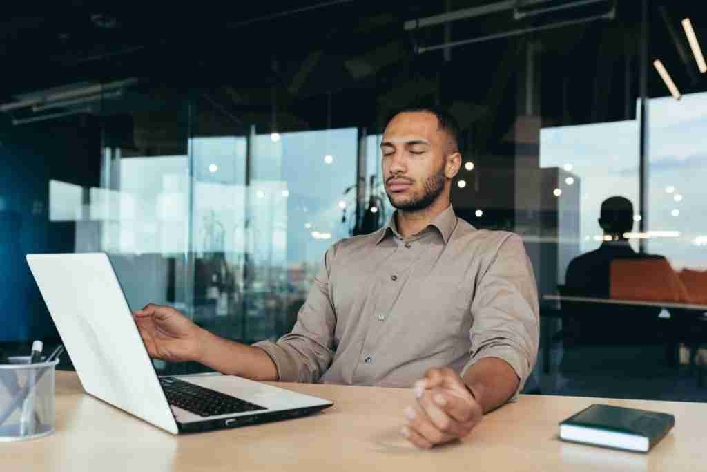 Man doing meditation at work