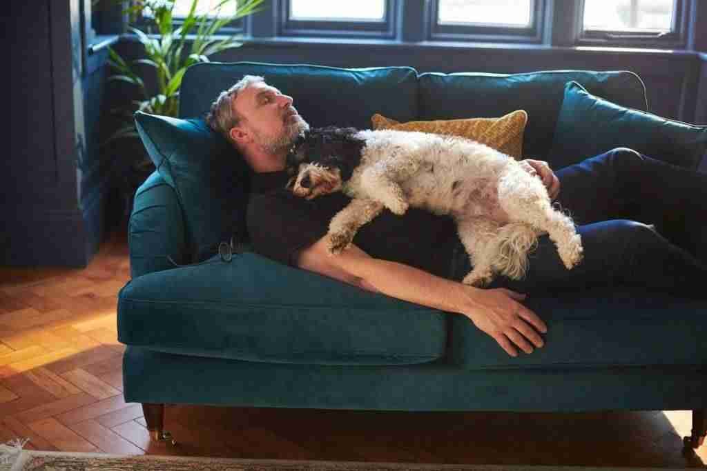 Man sleeping with his dog