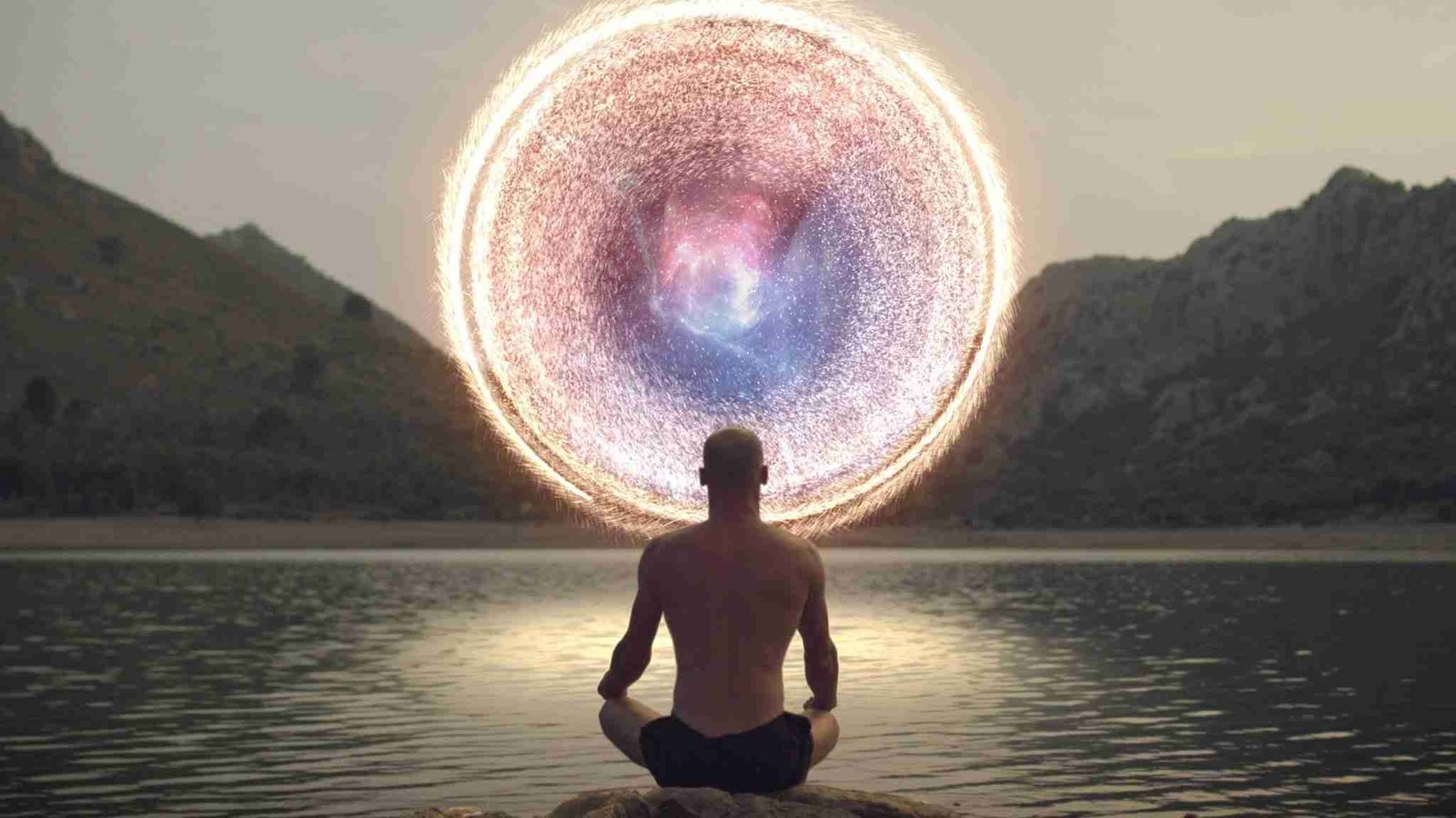 Meditating man opening portal to cosmic energy.