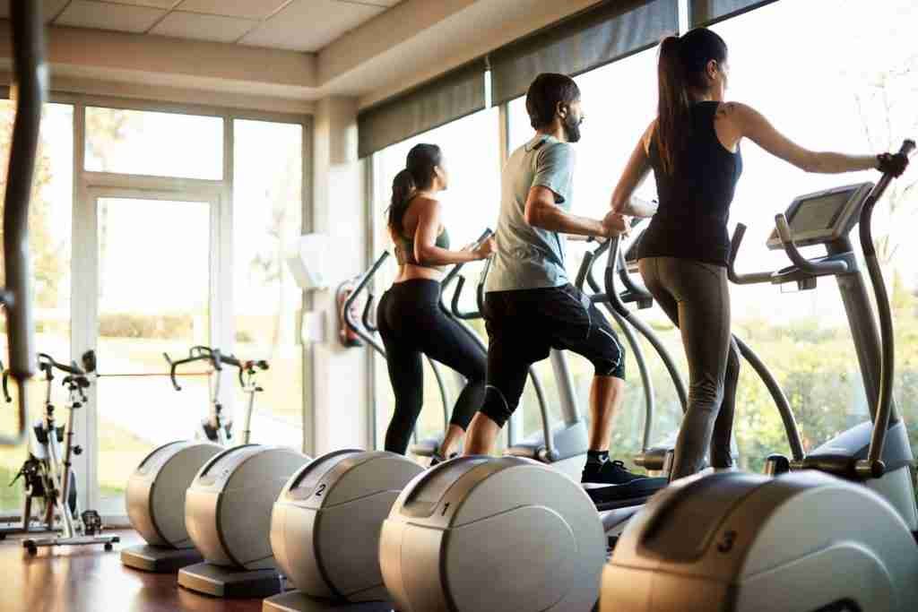 People working out on a cross-trainer