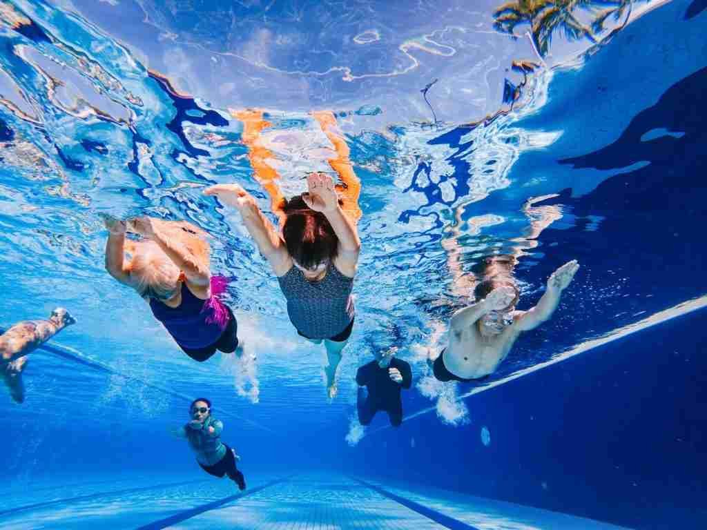 Senior swimming under water