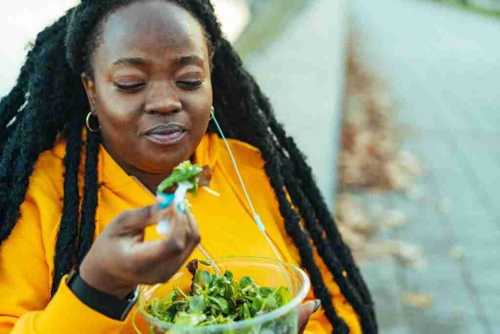 Sportswoman eating a salad