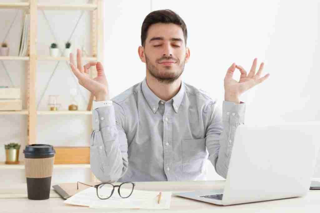 Man doing meditation at work