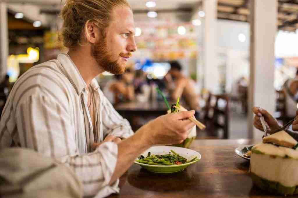 man eating vegan food