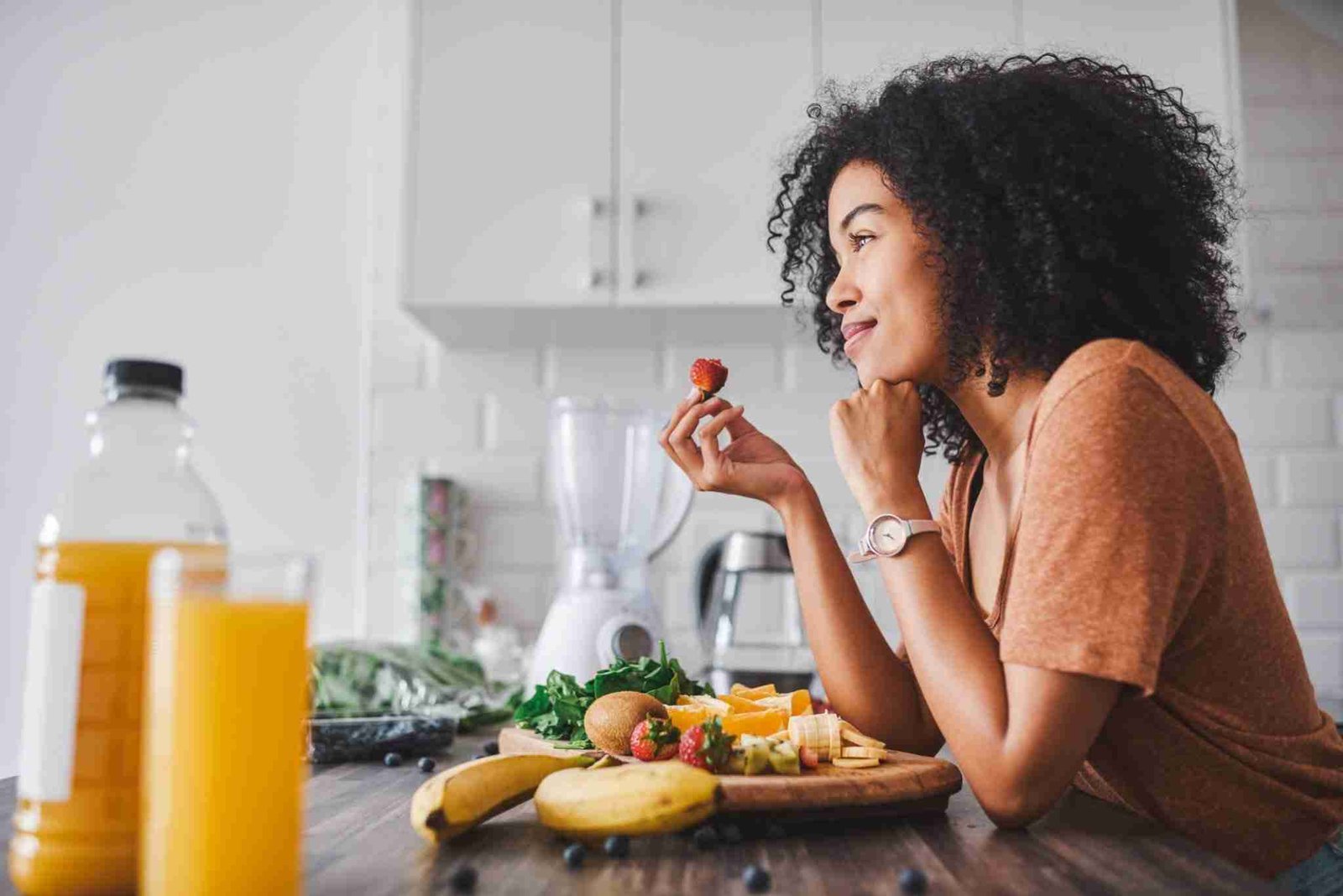 A lady eating healthy instead of doing a detox