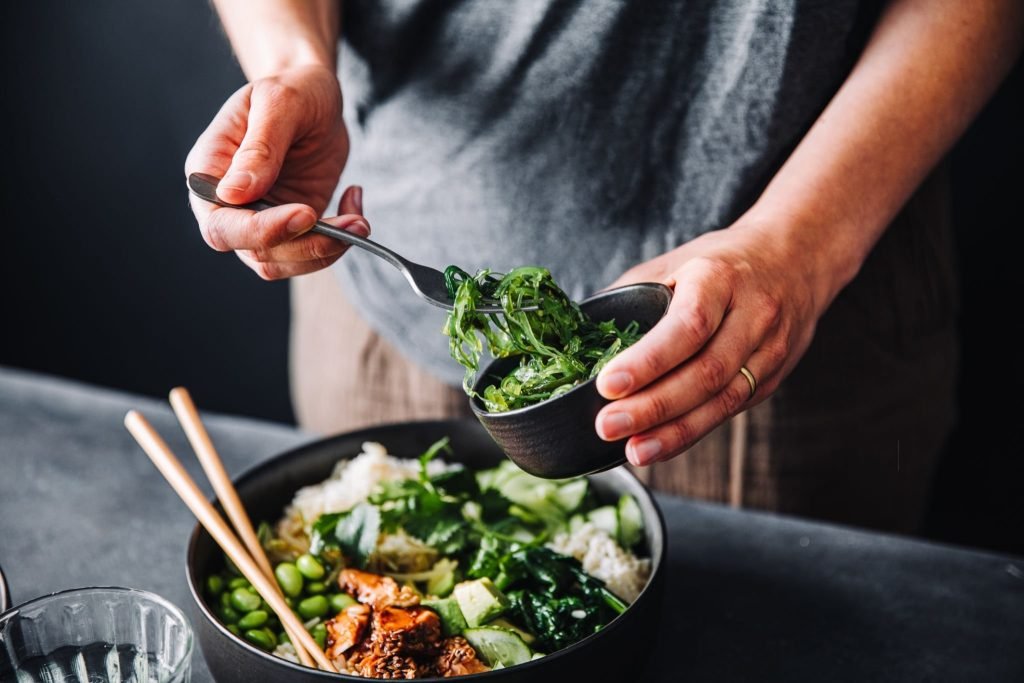 woman eating omega 3 rich salad