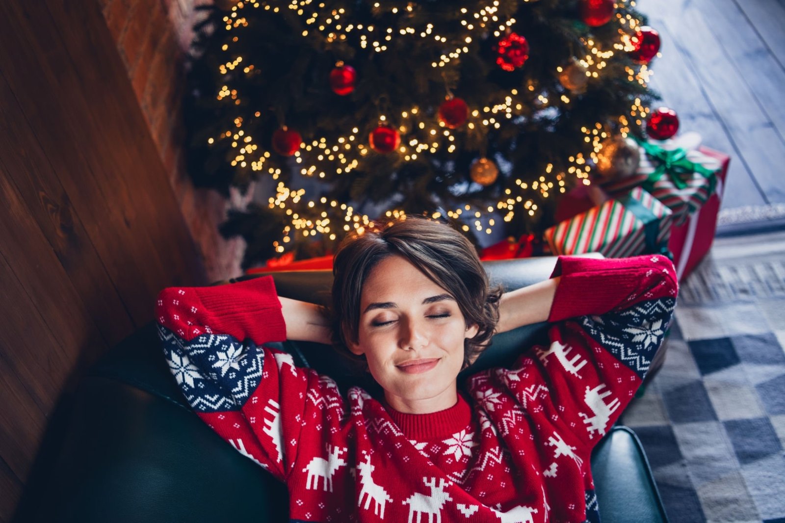 A lady napping on the sofa at Christmas